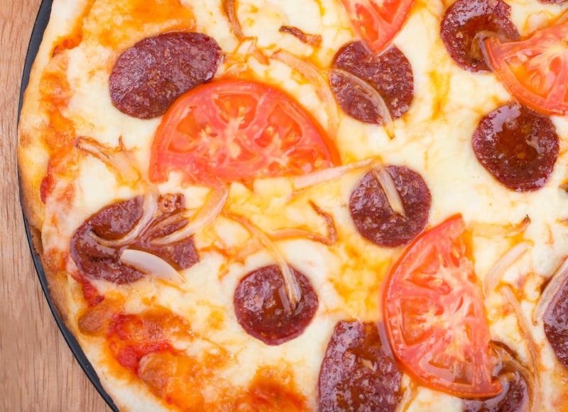 Pequod's pizza catering event spread with fresh pizzas